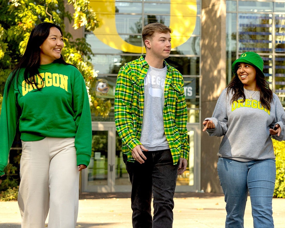 three UO students wearing branded clothing