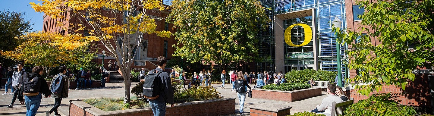students walking in front of Lundquist College of Business