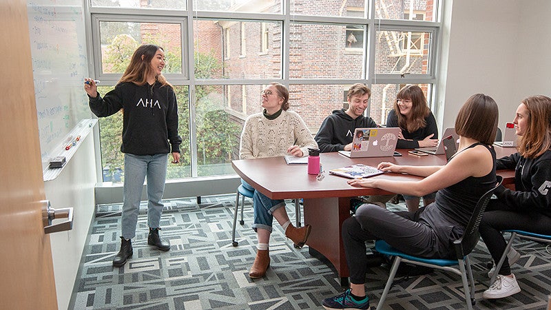 Students meeting in a conference room