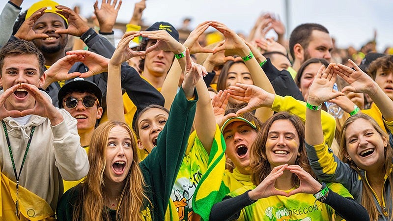 a group of people making the O with their hands