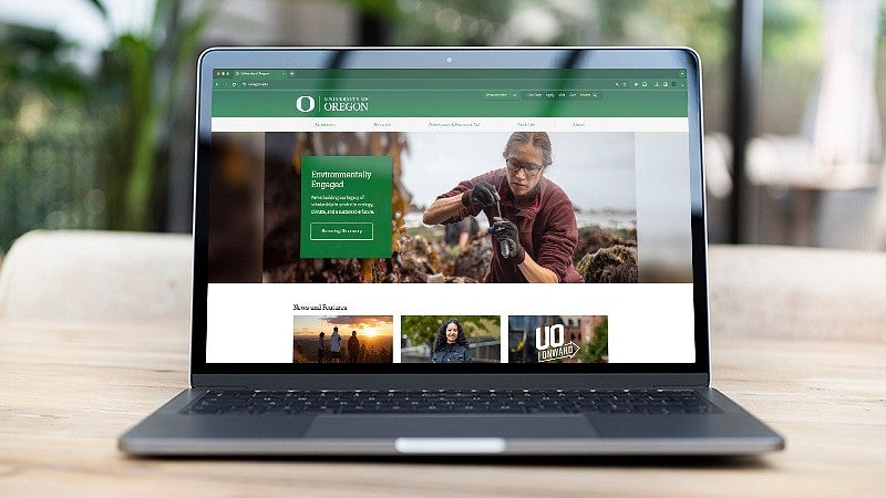 the UO homepage on a laptop screen