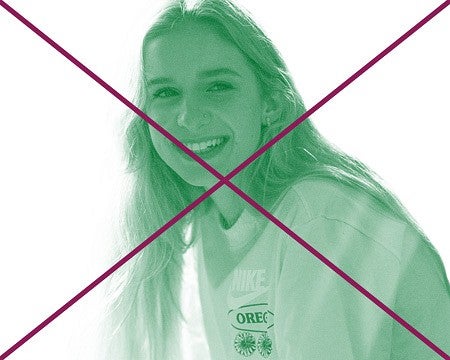 a crossed out photo of a person smiling in green monotone with a white background