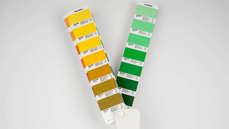 pantone swatch cards showing a range of yellow and green colors