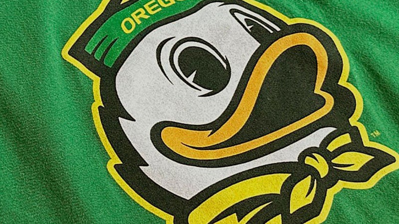 oregon duck mascot mark on a green shirt