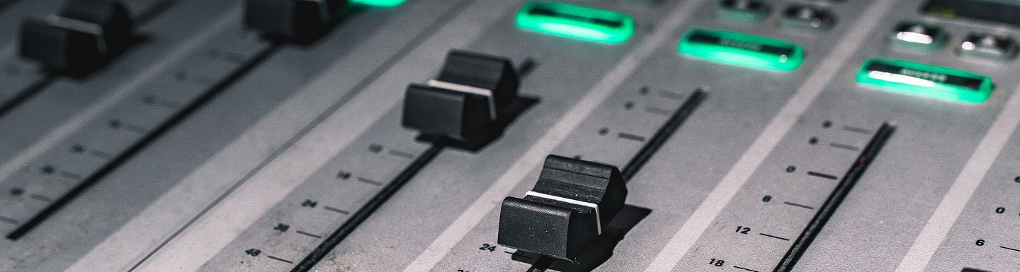 knobs on a sound mixing board