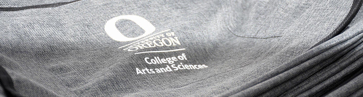 college of arts and sciences departmental logo on a gray shoulder bag