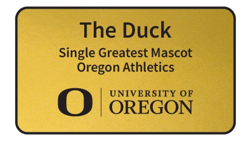 UO branded name badge with black text on a gold background.